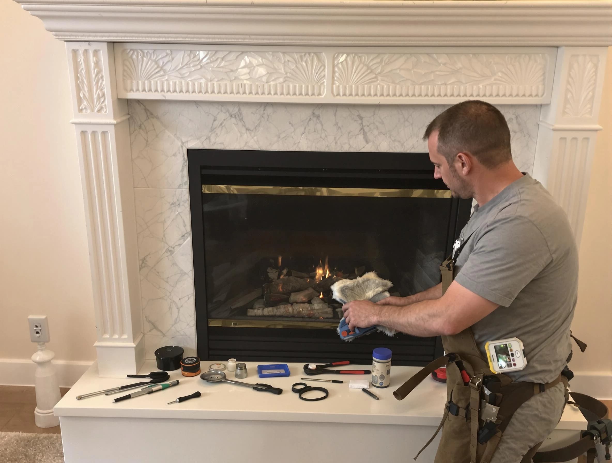 Canton Chimney Sweep performing fireplace maintenance in Canton, MA